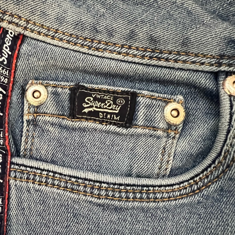 Superdry Vintage Blue Jeans & Red Logo Stripe Studs Blue Stripe Size W27 L30 EUC - Picture 4 of 12